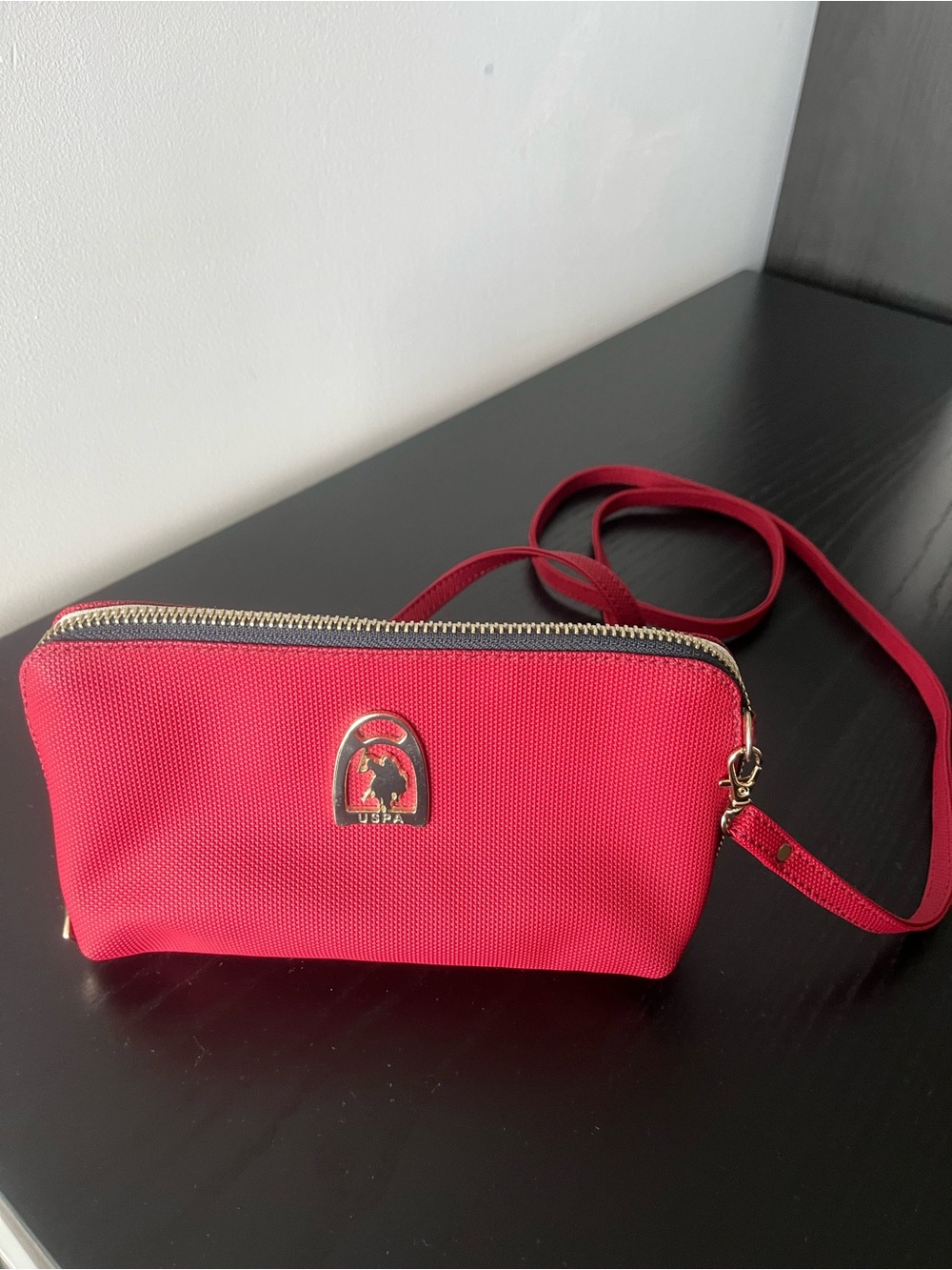 U.S. Polo Assn. red crossbody bag.